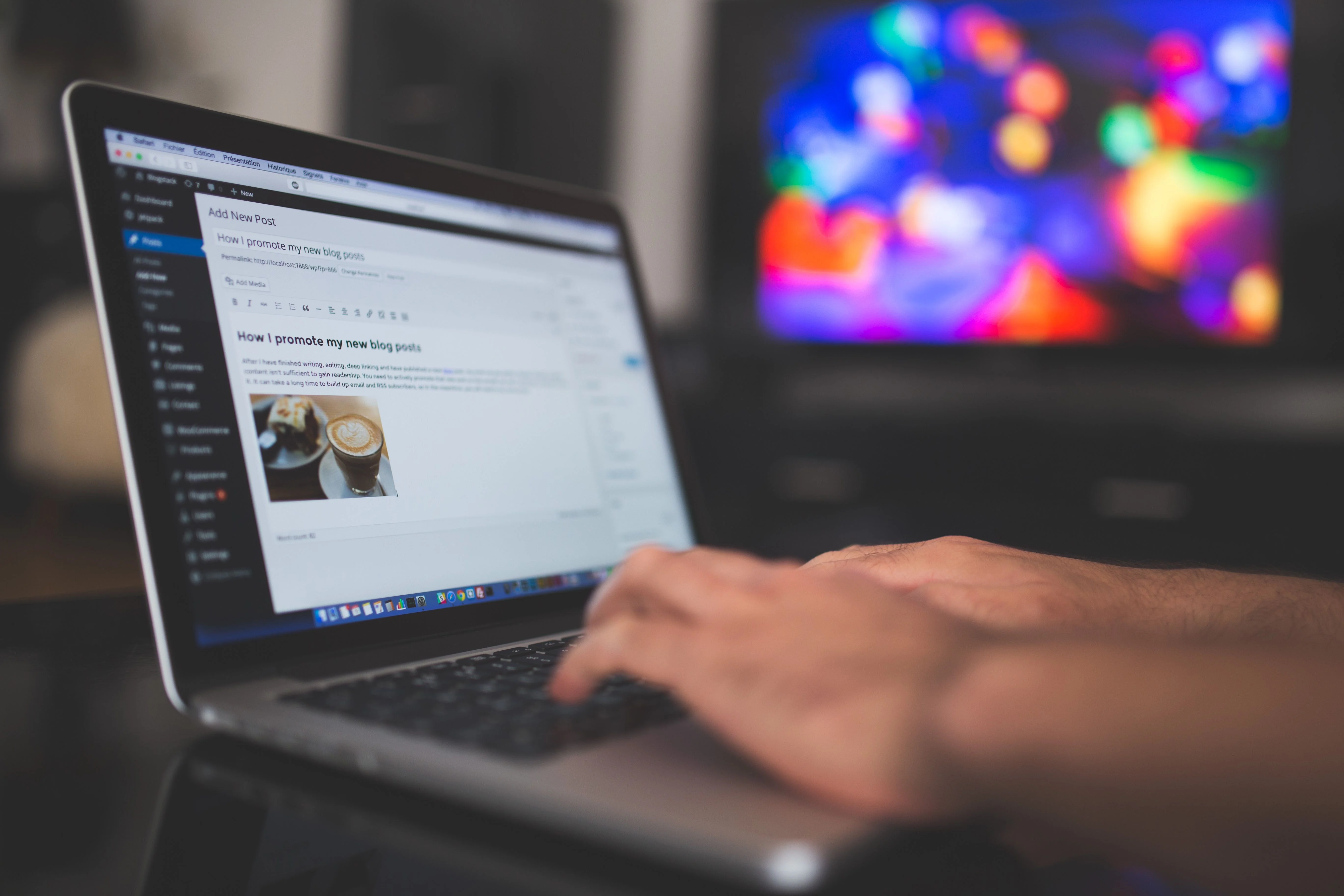 Shopify store owner reviewing blog traffic and sales data on a laptop to find where readers drop off before buying