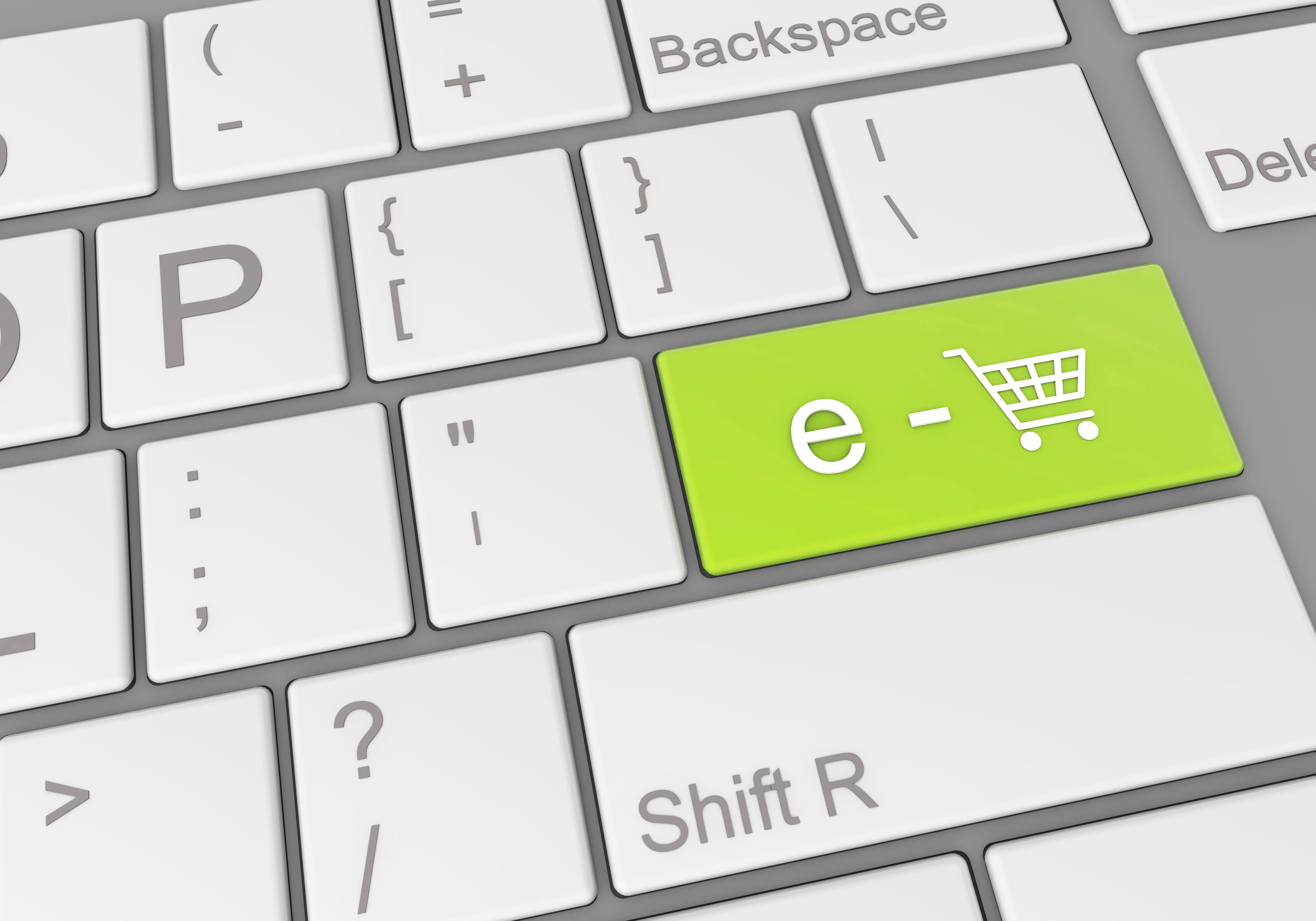 Ecommerce analyst comparing two Shopify product page variations side by side on a laptop to decide which converts better