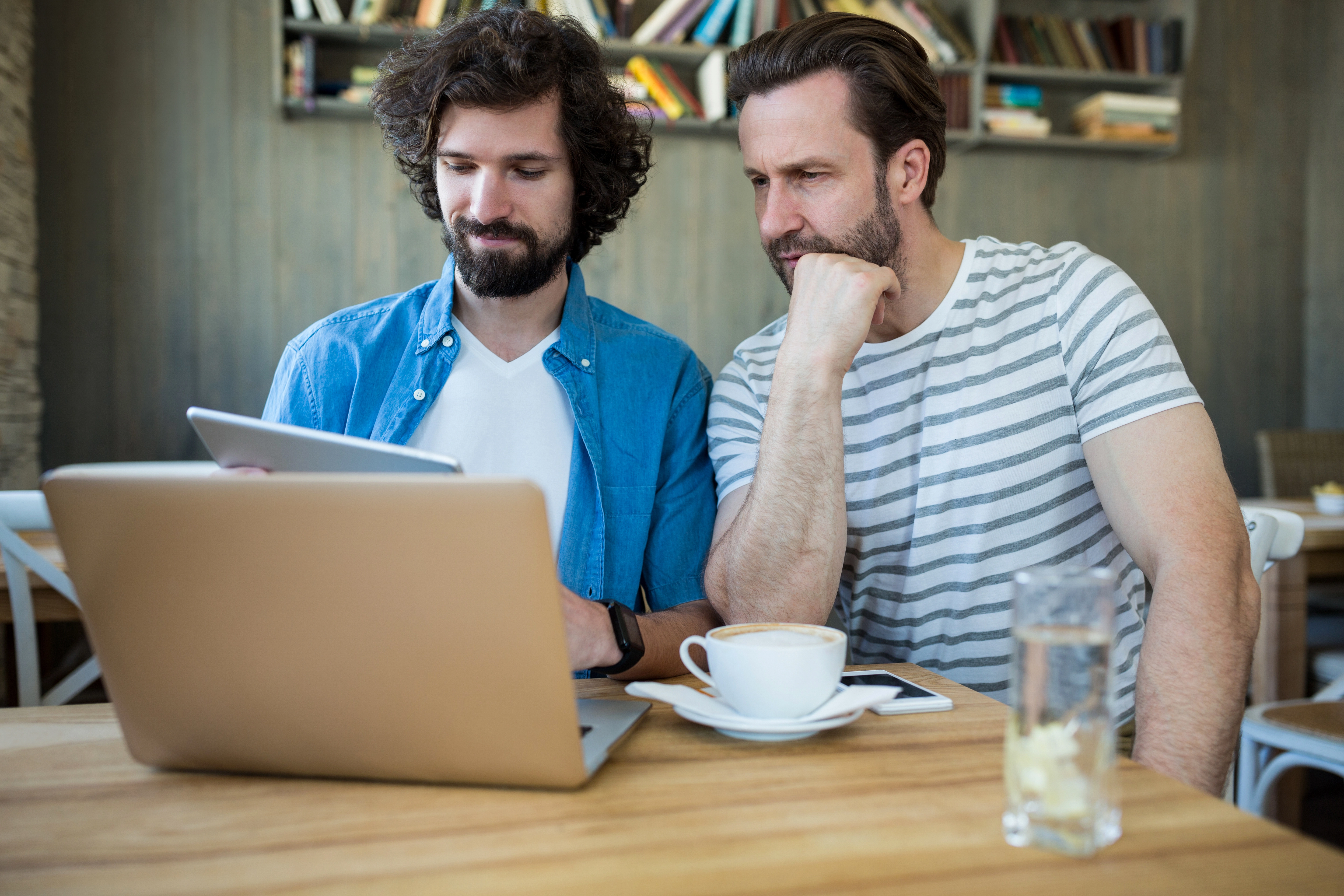 Two colleagues reviewing store SEO, Core Web Vitals and analytics on a tablet and a laptop